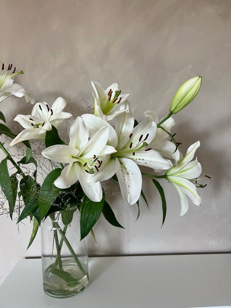Oriental Lillies mixed with Festive Foliage